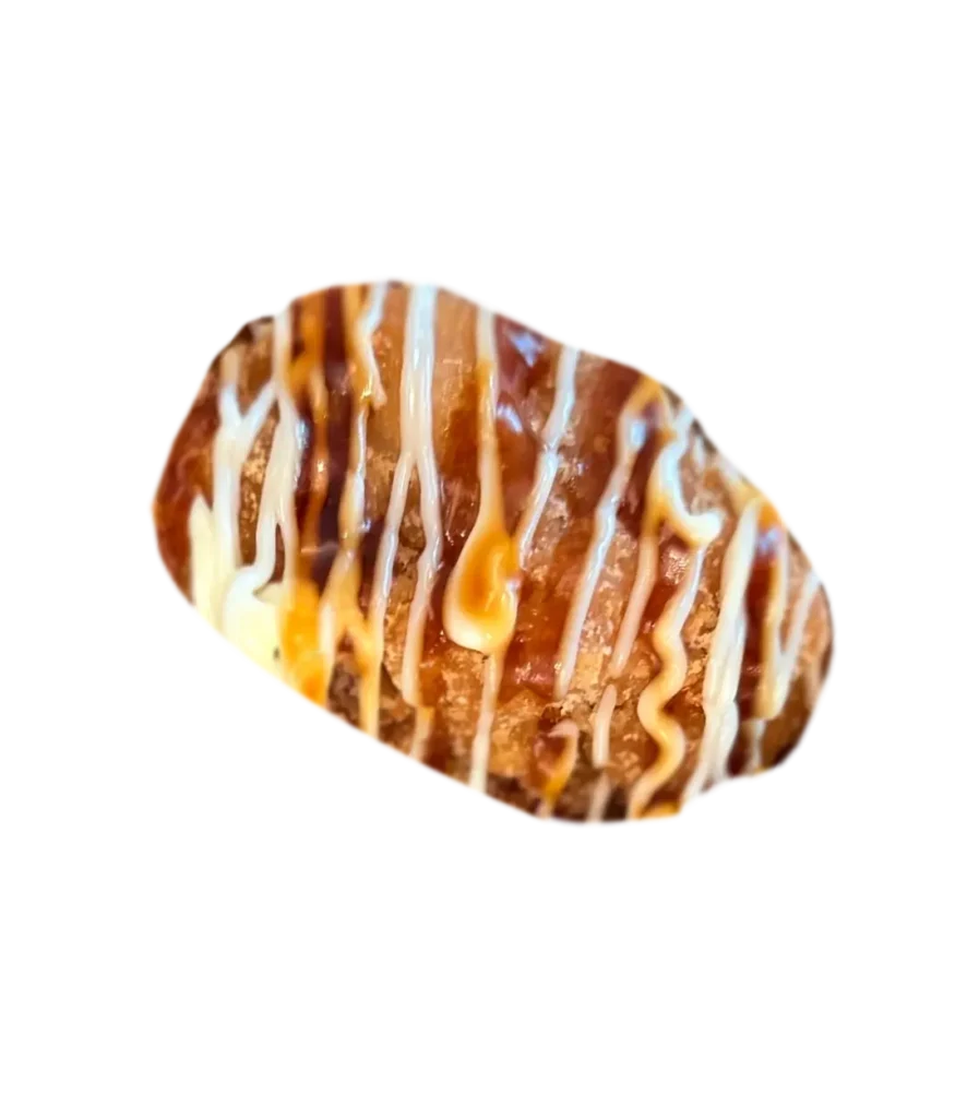 A piece of beef with sauces